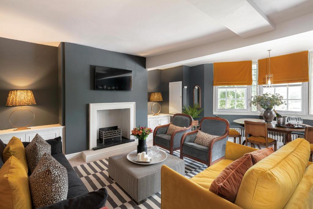 a living room with a couch and a fireplace at Central Apartment With Private Parking in Bath