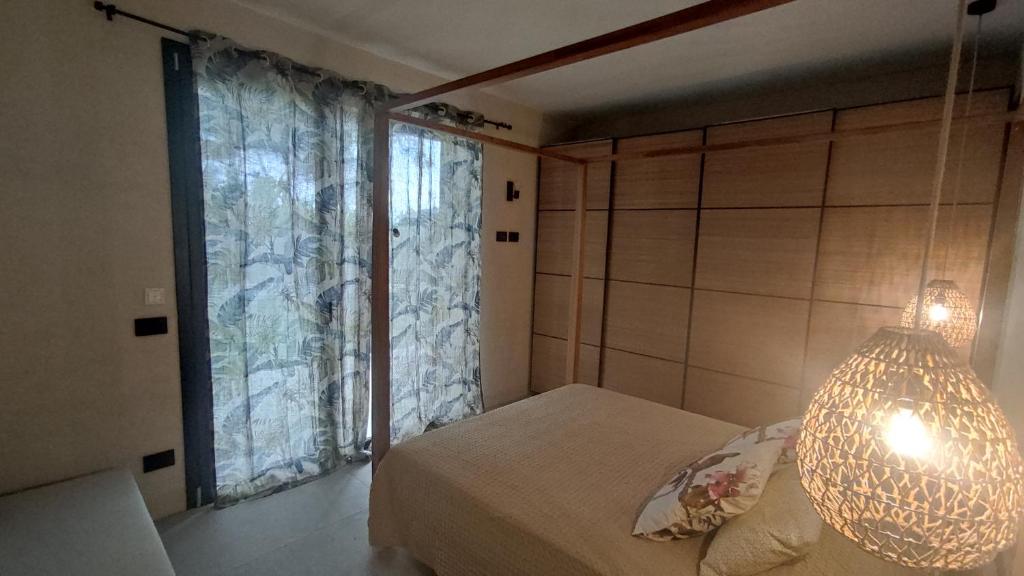 Postel nebo postele na pokoji v ubytování Villa Agapanto