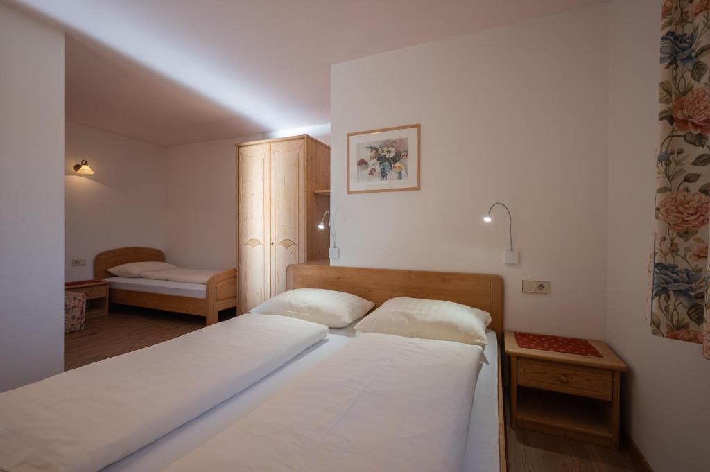 Postel nebo postele na pokoji v ubytování Residence Treyer
