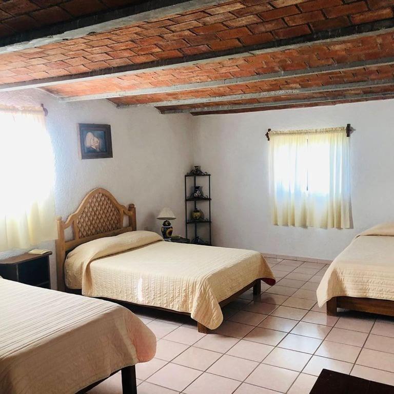 Postel nebo postele na pokoji v ubytování Manzano B&B