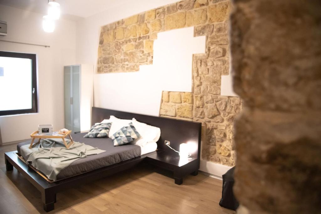 Postel nebo postele na pokoji v ubytování La Giudecca Trani