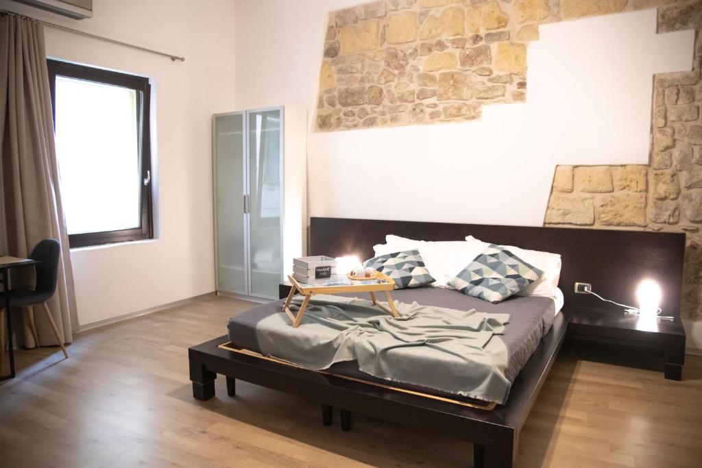 Postel nebo postele na pokoji v ubytování La Giudecca Trani