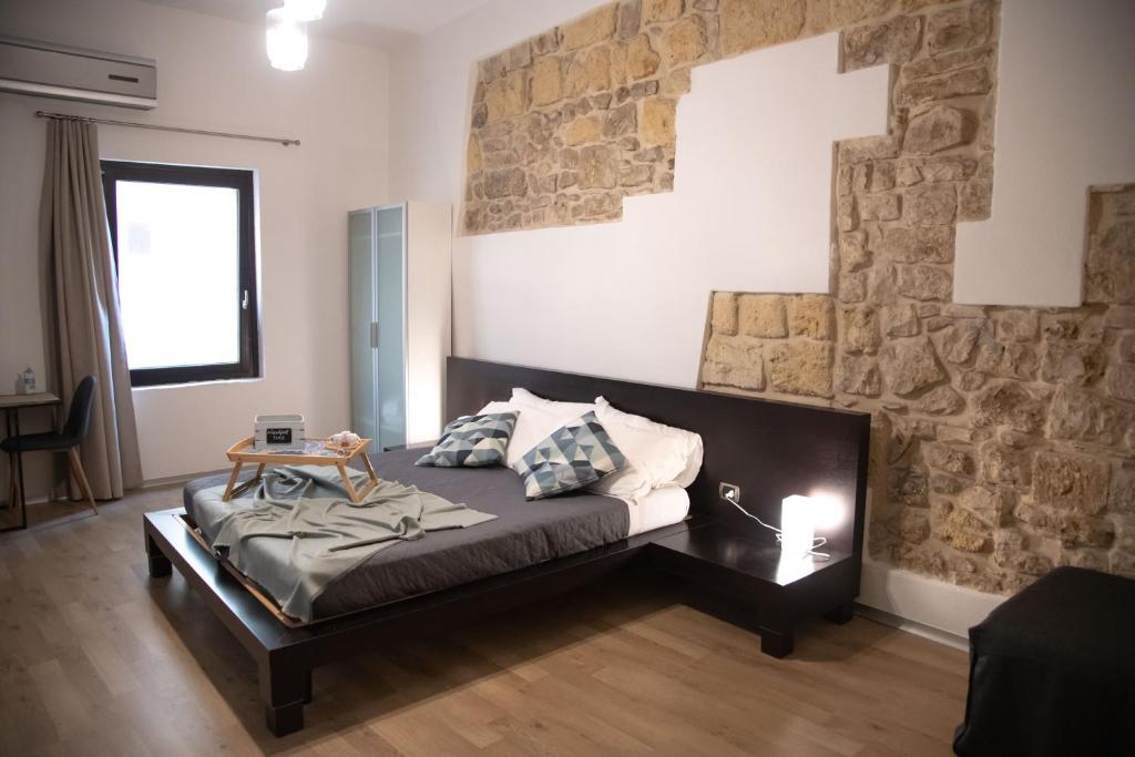 Postel nebo postele na pokoji v ubytování La Giudecca Trani
