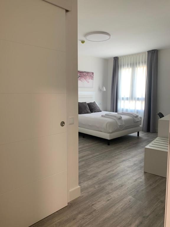 Postel nebo postele na pokoji v ubytování Hostal Comfort Suites