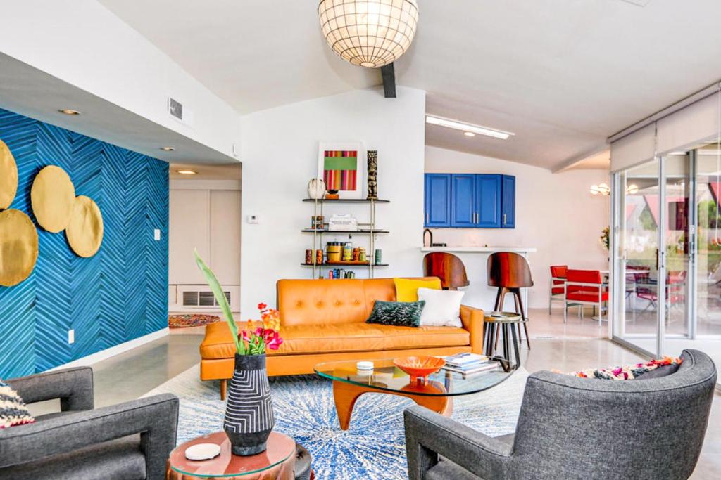 a living room with a couch and a table at The Royal Hawaiian in Palm Springs