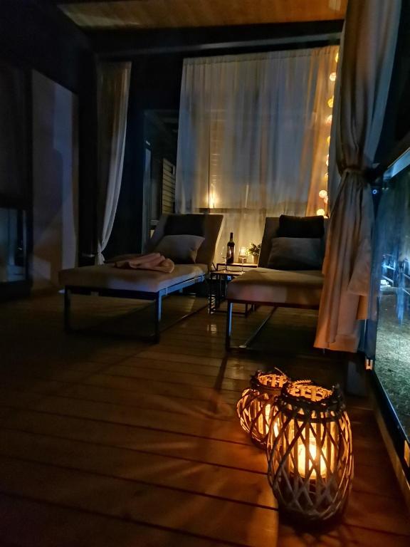 a living room with a couch and a table at Mobile Home Erna, Rovinj in Rovinj