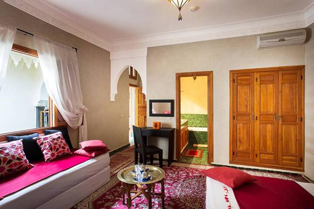 Postel nebo postele na pokoji v ubytování Arabian Riad Marrakech