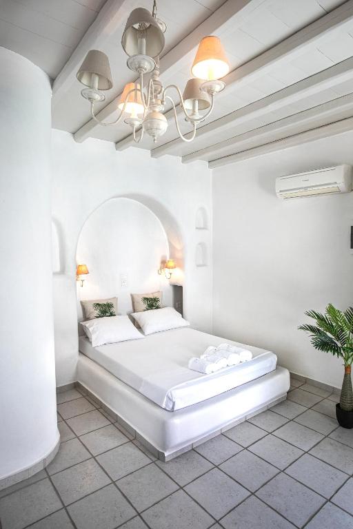 Postel nebo postele na pokoji v ubytování Onar Hotel & Suites