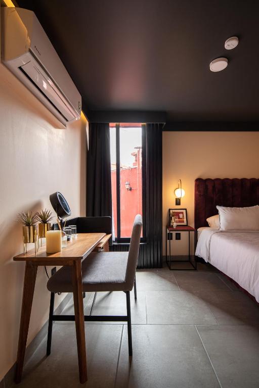 Postel nebo postele na pokoji v ubytování Casa Nada Hotel