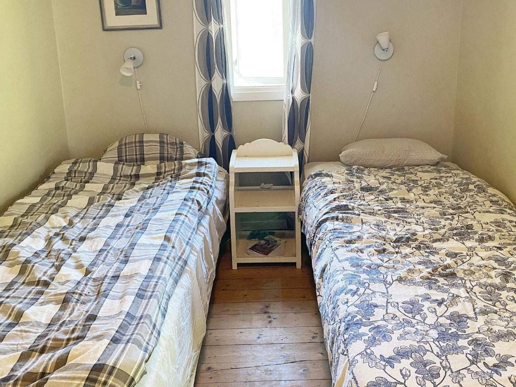 Postel nebo postele na pokoji v ubytování 4 person holiday home in VETLANDA-By Traum