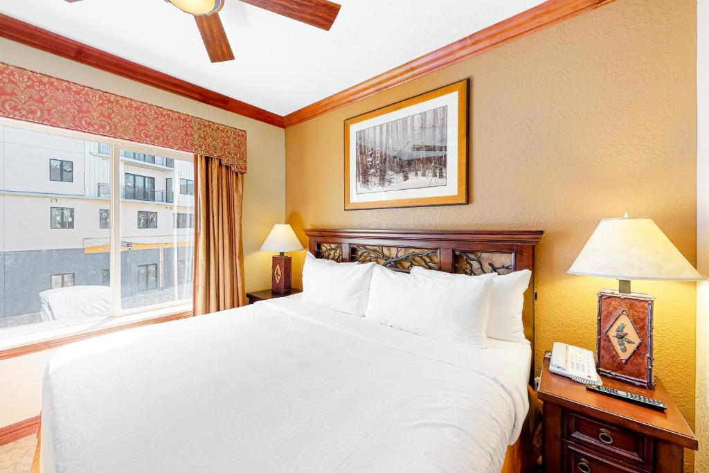 a bedroom with a white bed and a window at Westgate Charm #4814B in Park City