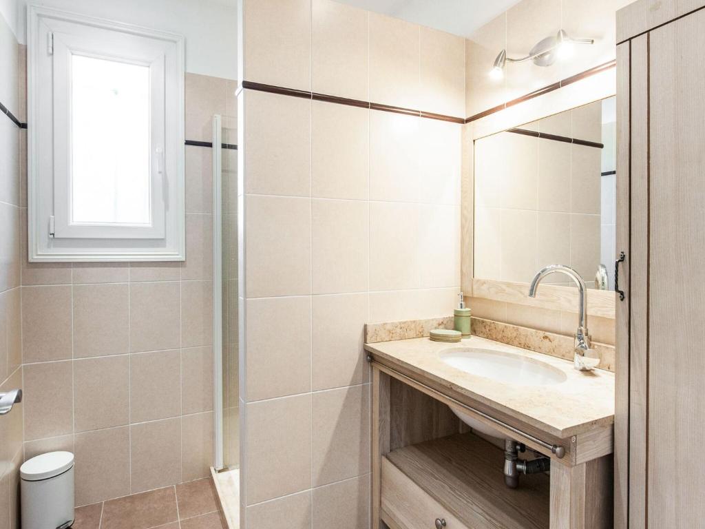 a bathroom with a sink and a shower at Holiday home in La Roquette sur Siane with furnished garden in La Roquette-sur-Siagne