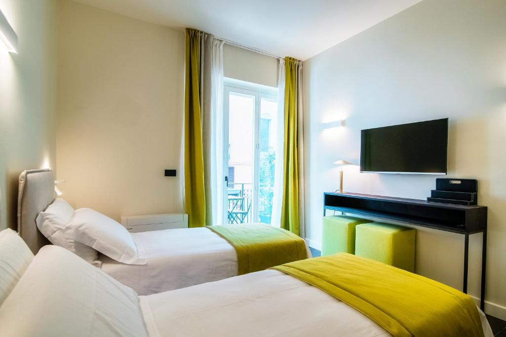 Кровать или кровати в номере In Centro Luxury Rooms