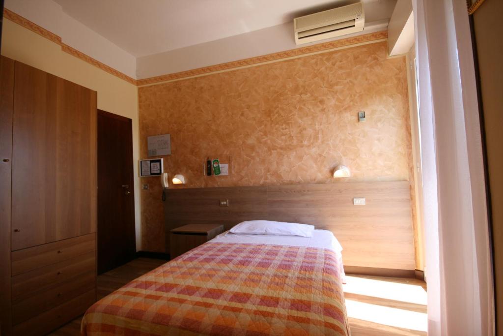 Postel nebo postele na pokoji v ubytování Albergo Centopini