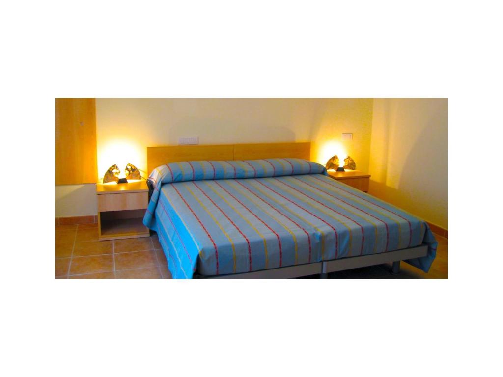 Postel nebo postele na pokoji v ubytování B&B & Residence Pozzo Misseo