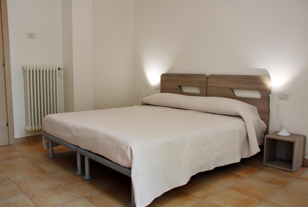 Postel nebo postele na pokoji v ubytování B&B & Residence Pozzo Misseo