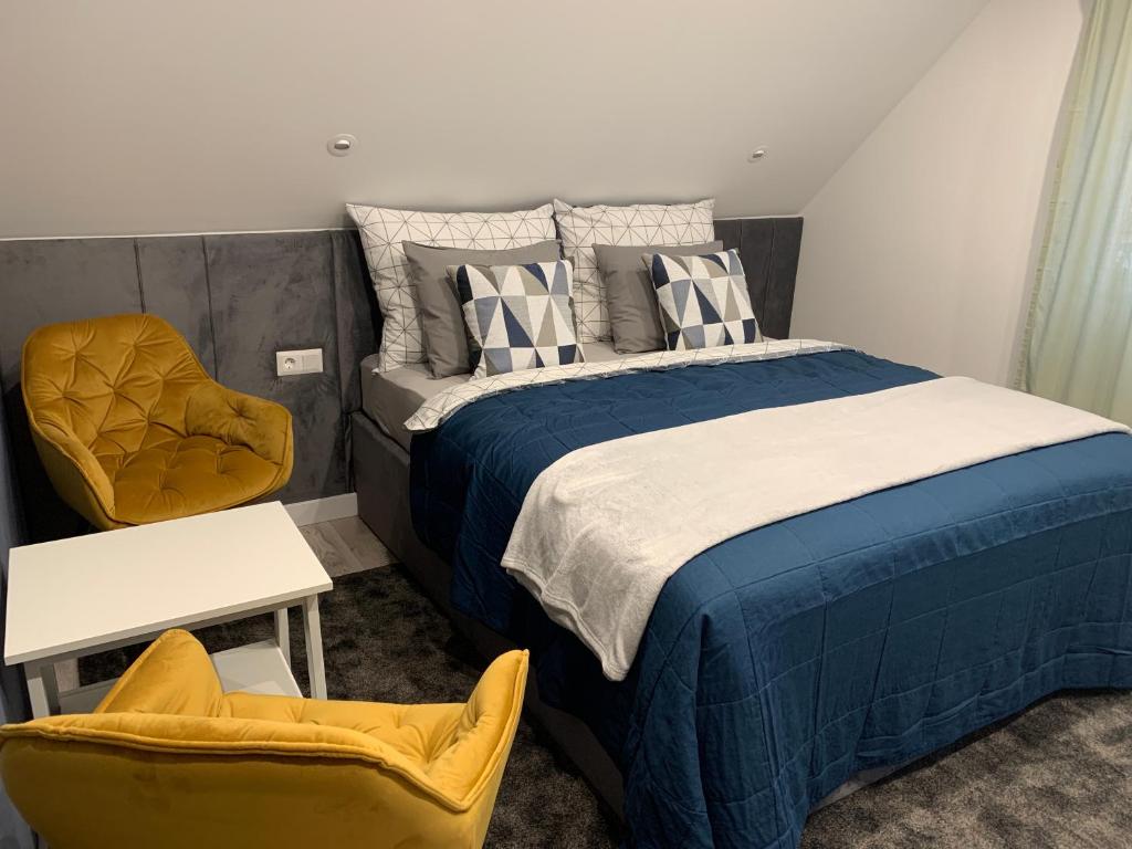 Voodi või voodid majutusasutuse Hollik Apartmanház toas