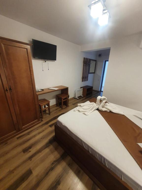 Postel nebo postele na pokoji v ubytování Casa Vlad