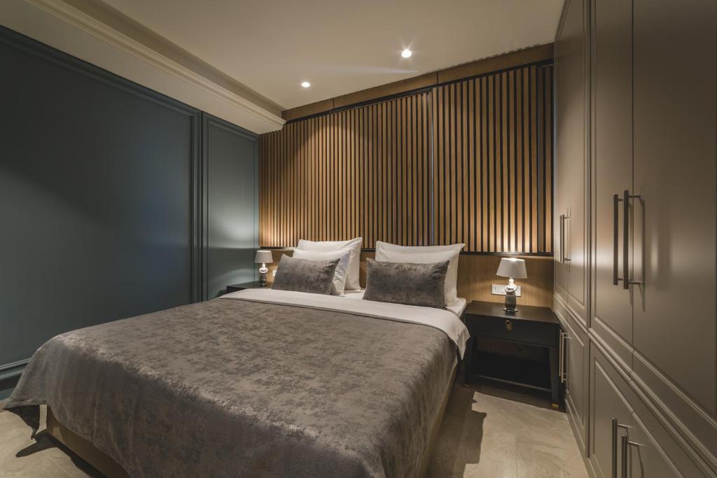 Postel nebo postele na pokoji v ubytování Kalamper Apartments