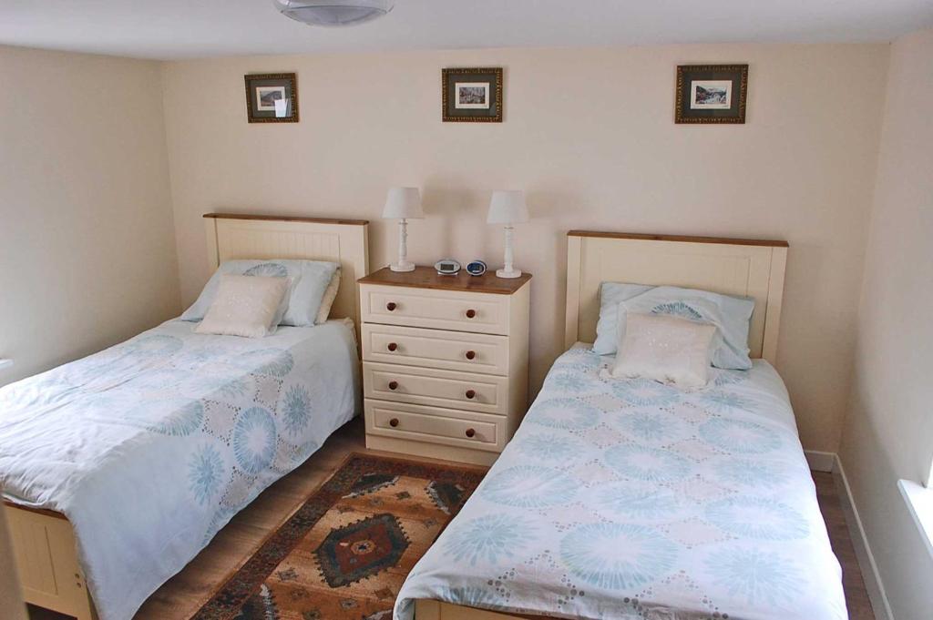 Postel nebo postele na pokoji v ubytování Glenbeigh Holiday Cottage - Tigin Mamo by Trident Holiday Homes