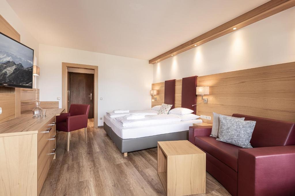 Postel nebo postele na pokoji v ubytování Hotel Pirchnerhof