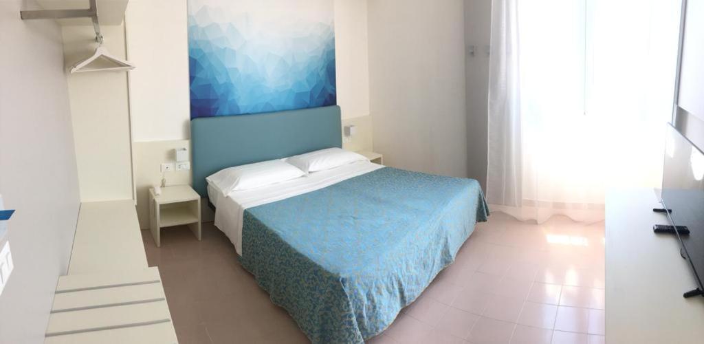 Postel nebo postele na pokoji v ubytování Hotel Principe