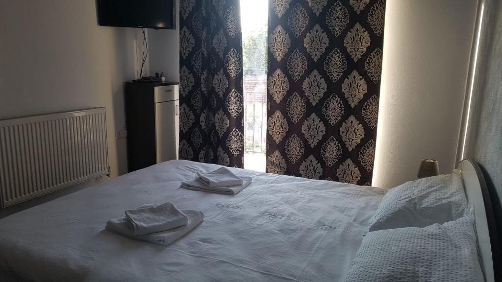 Ένα ή περισσότερα κρεβάτια σε δωμάτιο στο Apartament TEO