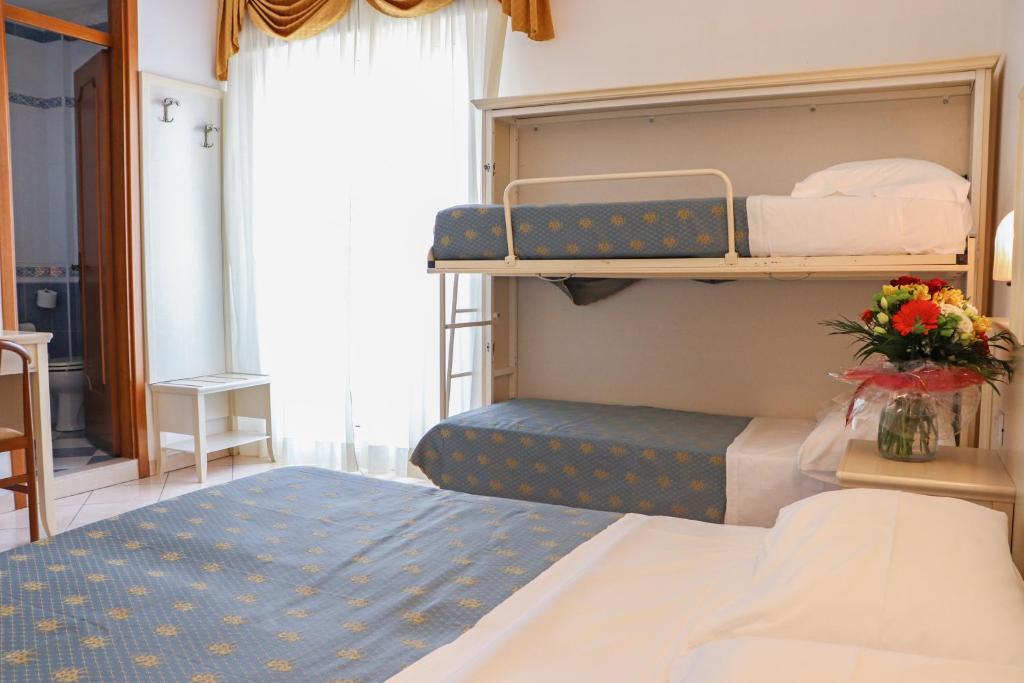 Postel nebo postele na pokoji v ubytování Hotel Principe