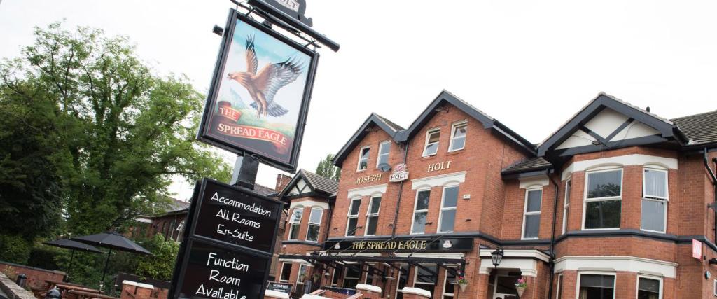 a street sign in front of a building at The Spread Eagle in Manchester