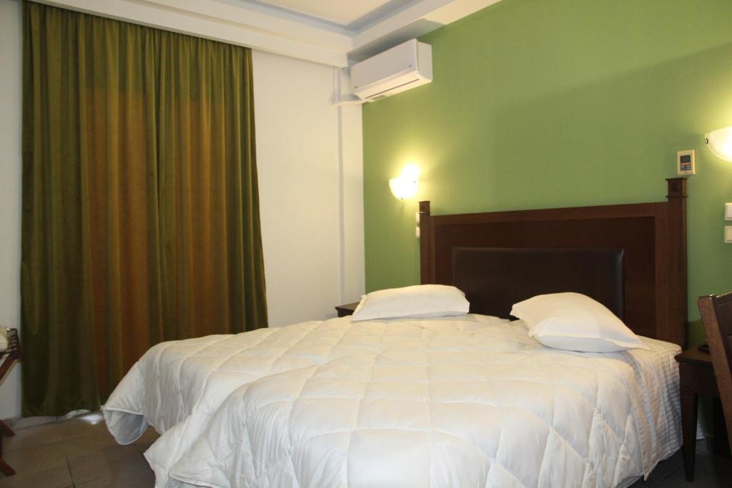 Postel nebo postele na pokoji v ubytování Hotel Selini