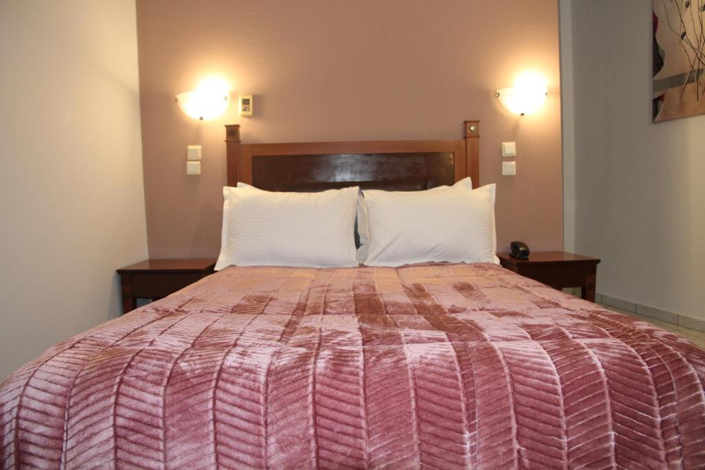 Postel nebo postele na pokoji v ubytování Hotel Selini