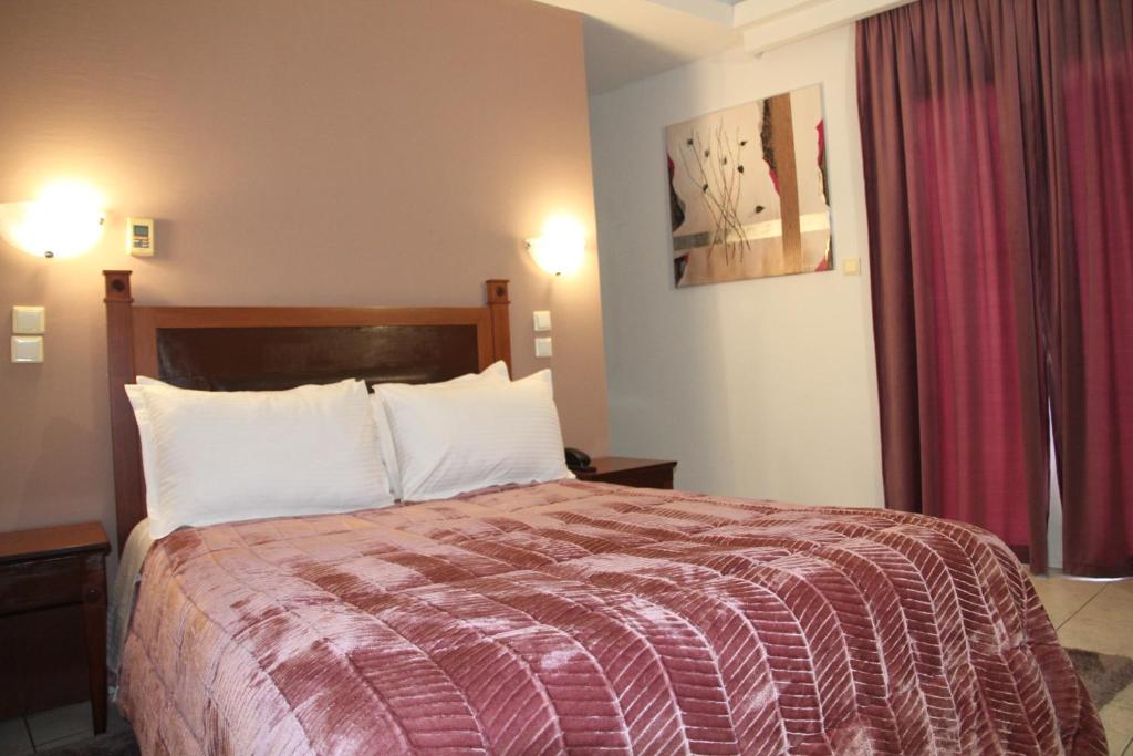 Postel nebo postele na pokoji v ubytování Hotel Selini