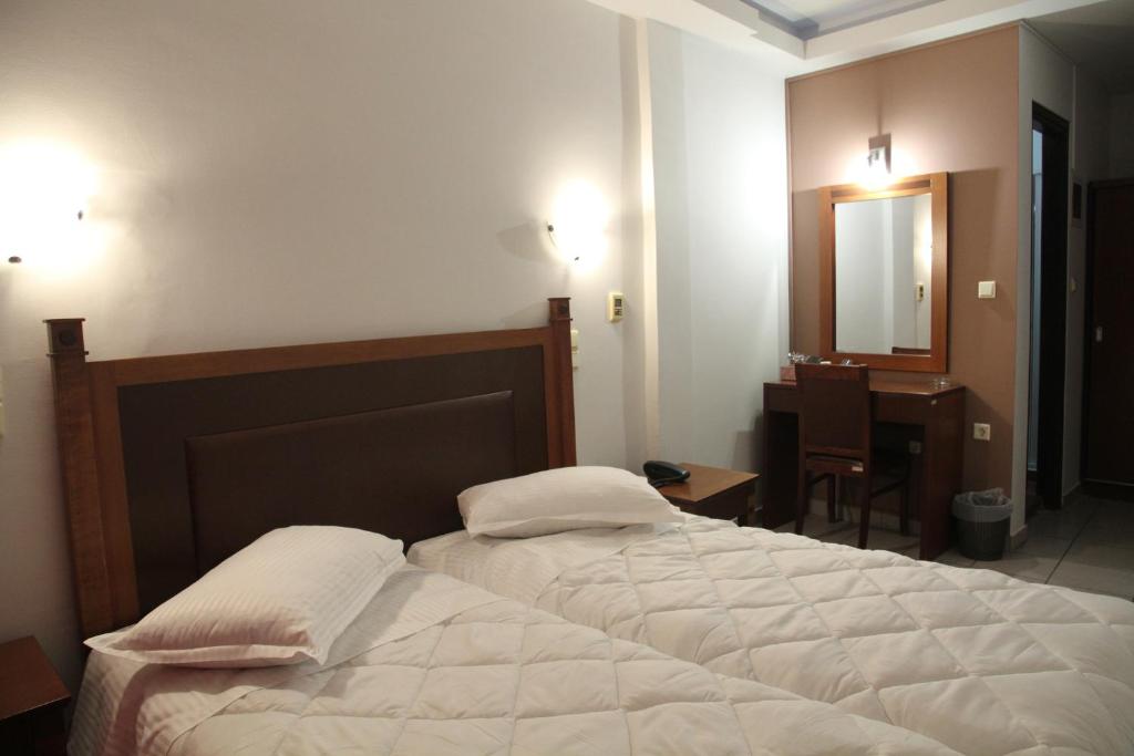 Postel nebo postele na pokoji v ubytování Hotel Selini