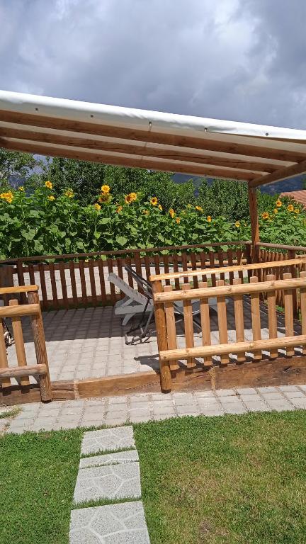 a wooden bench sitting on top of a patio at Astra in Agerola