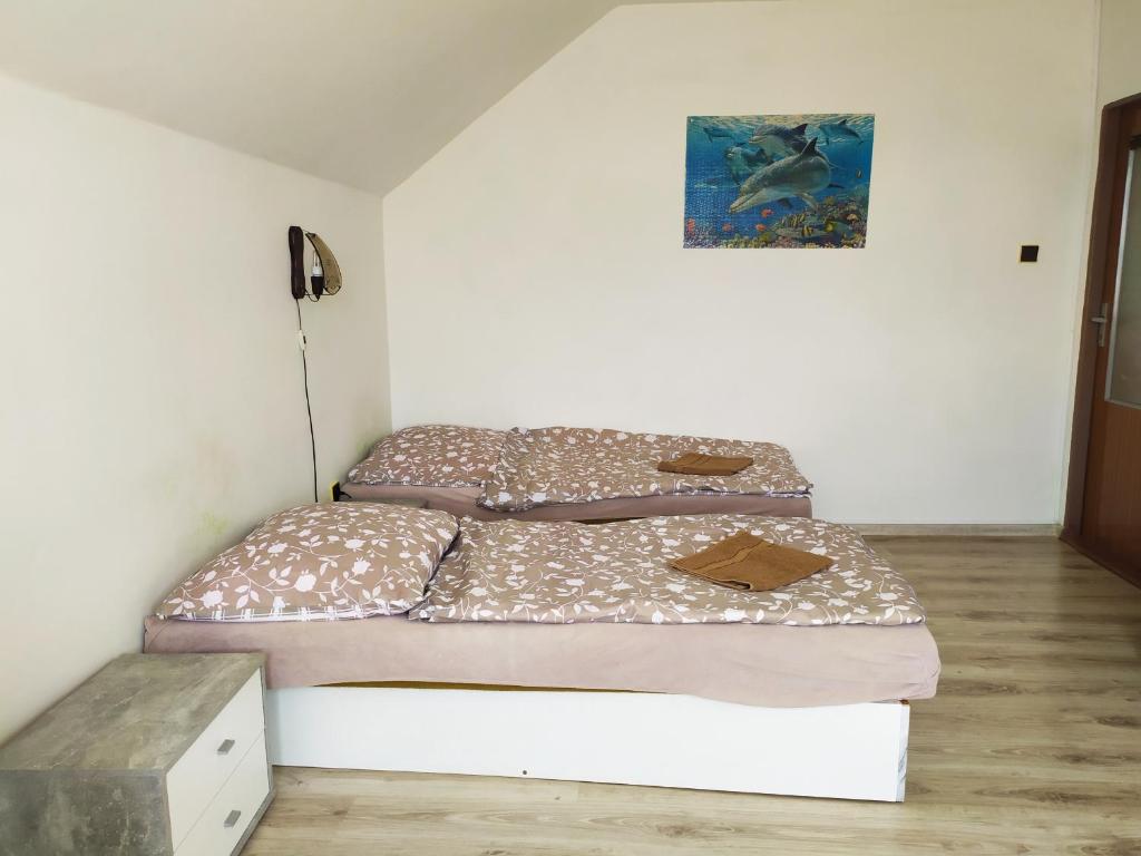 Łóżko lub łóżka w pokoju w obiekcie Penzion Renata