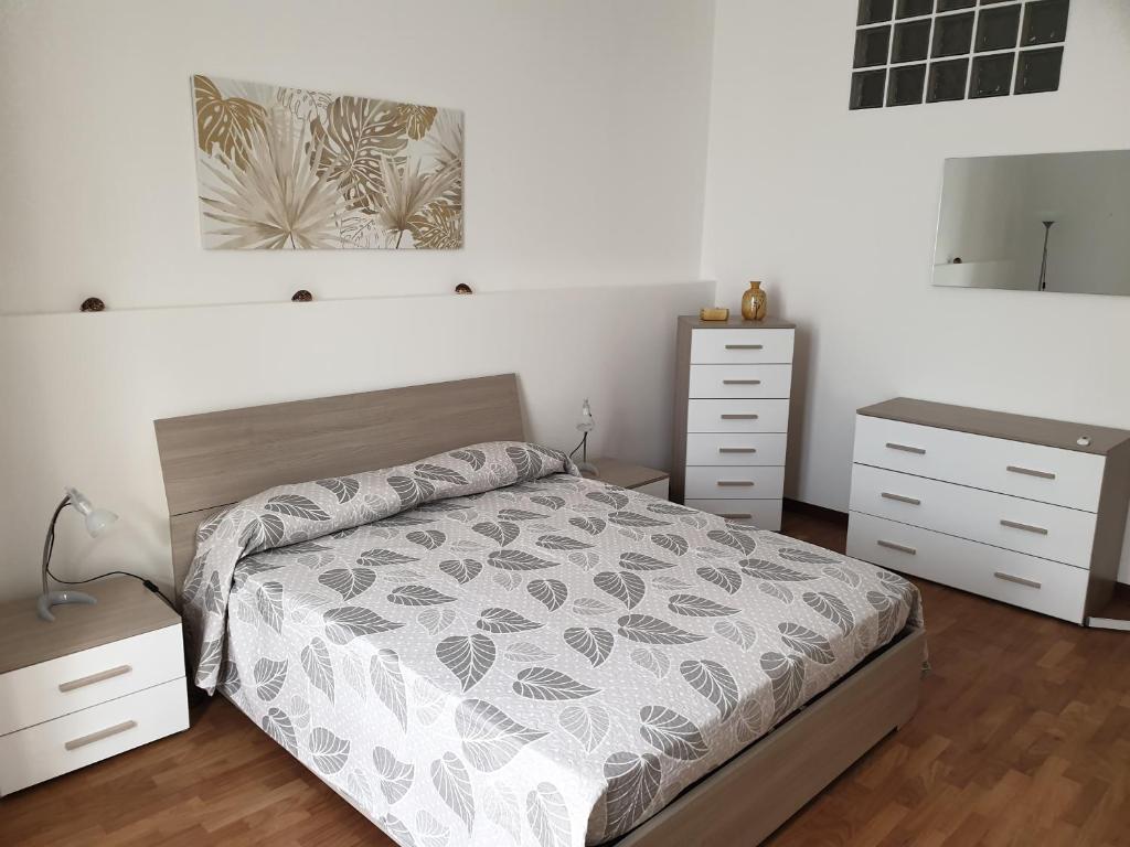 A bed or beds in a room at Casa Fiorella