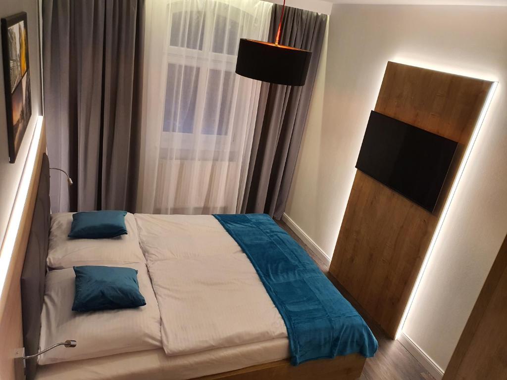 Posteľ alebo postele v izbe v ubytovaní Apartamenty Polonia Mrągowo