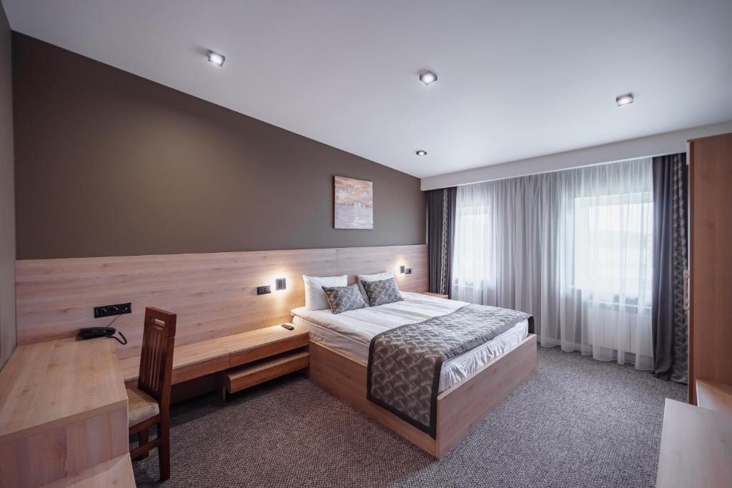 Postel nebo postele na pokoji v ubytování Rudison Hotel & Restaurant