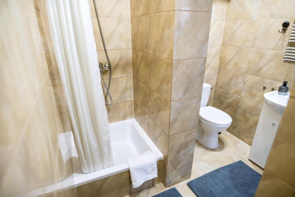 Kúpeľňa v ubytovaní Apartamenty Centrum Biskupiec