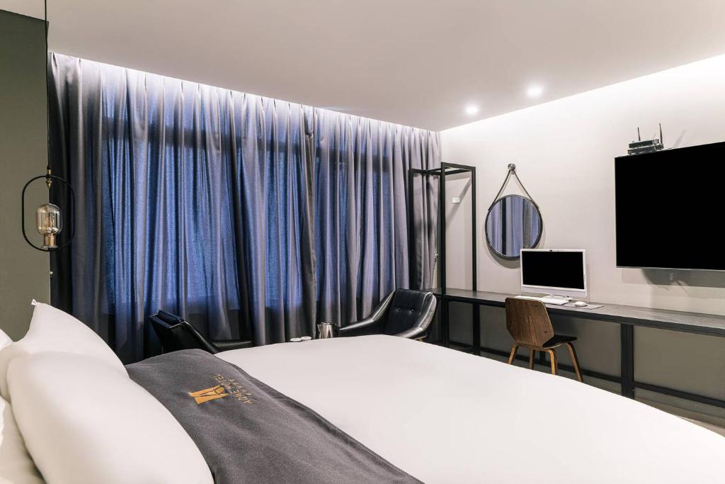 TV a/nebo společenská místnost v ubytování Namyangju Aone Hotel