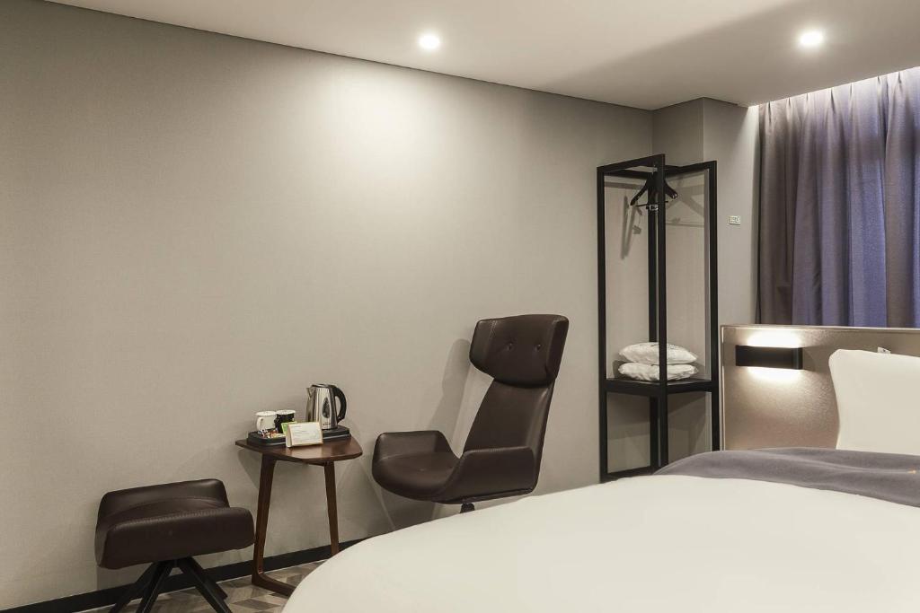 Postel nebo postele na pokoji v ubytování Namyangju Aone Hotel