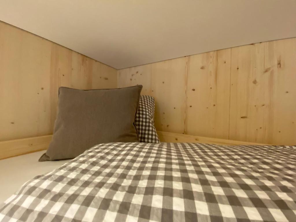 a bedroom with a bed and a pillow at Gasthaus Sulzfluh in Schruns