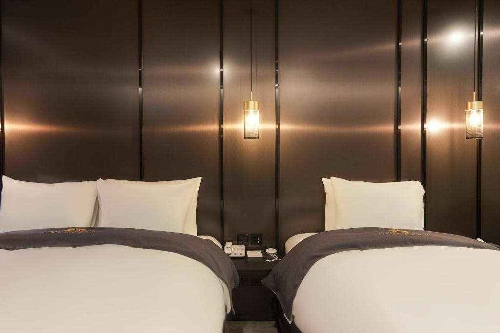 Postel nebo postele na pokoji v ubytování Namyangju Aone Hotel