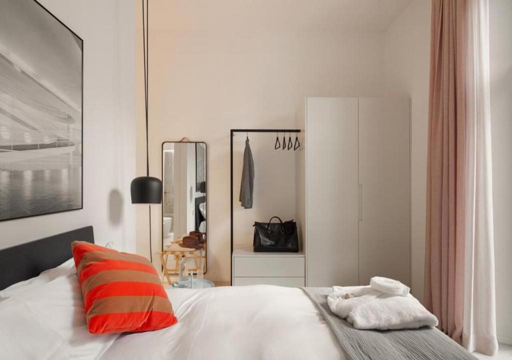 Posteľ alebo postele v izbe v ubytovaní BB Hotels Aparthotel Collection Il Michelangelo