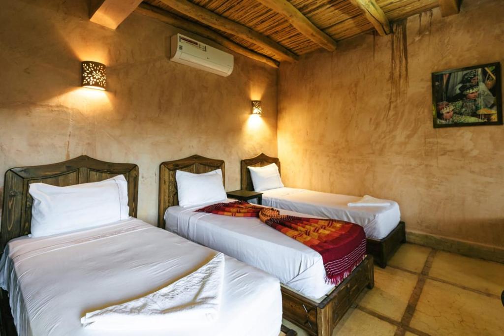 Een bed of bedden in een kamer bij Palais D'Ouzoud