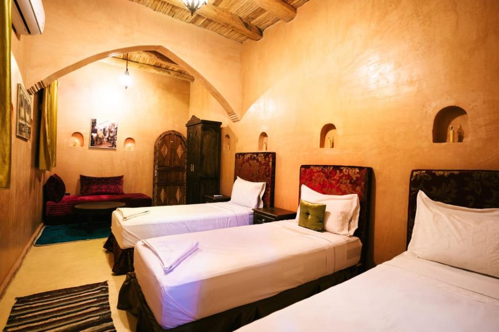 Een bed of bedden in een kamer bij Palais D'Ouzoud