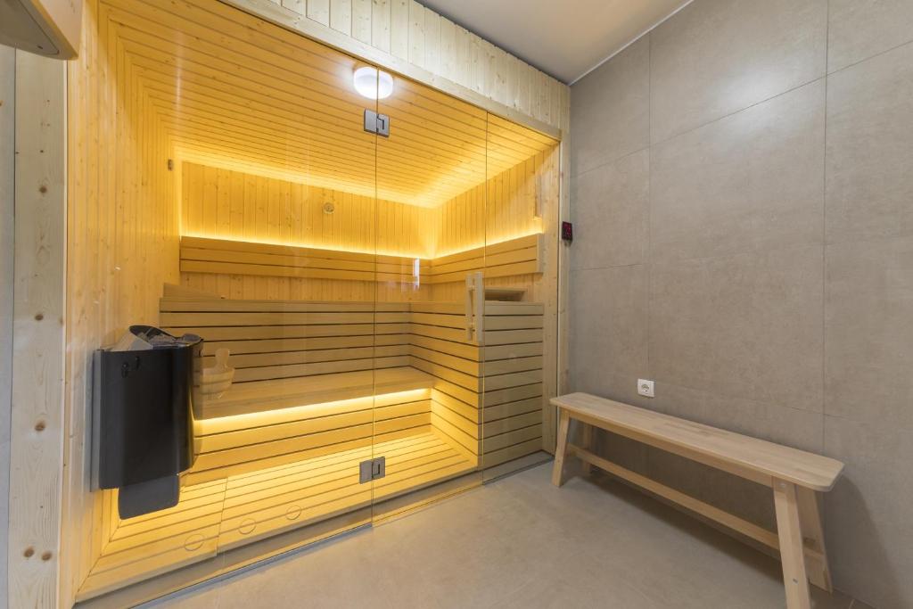 a sauna with a bench in a room at Cozy House Ania in Plitvička Jezera