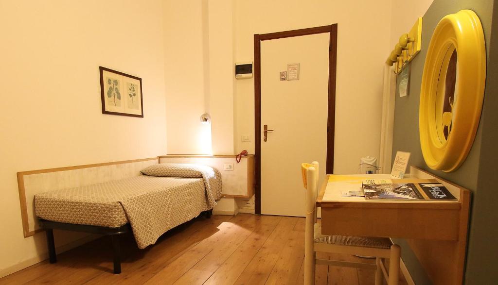 Postel nebo postele na pokoji v ubytování Hotel Giardino