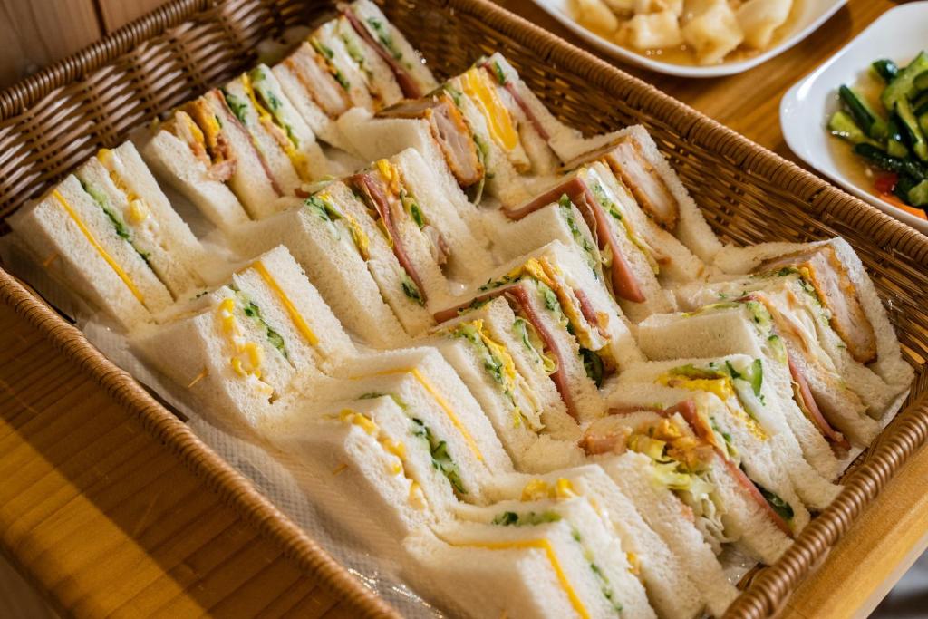a tray of sandwiches sitting on top of a table at Brulee&#39;s Done in Dongshan