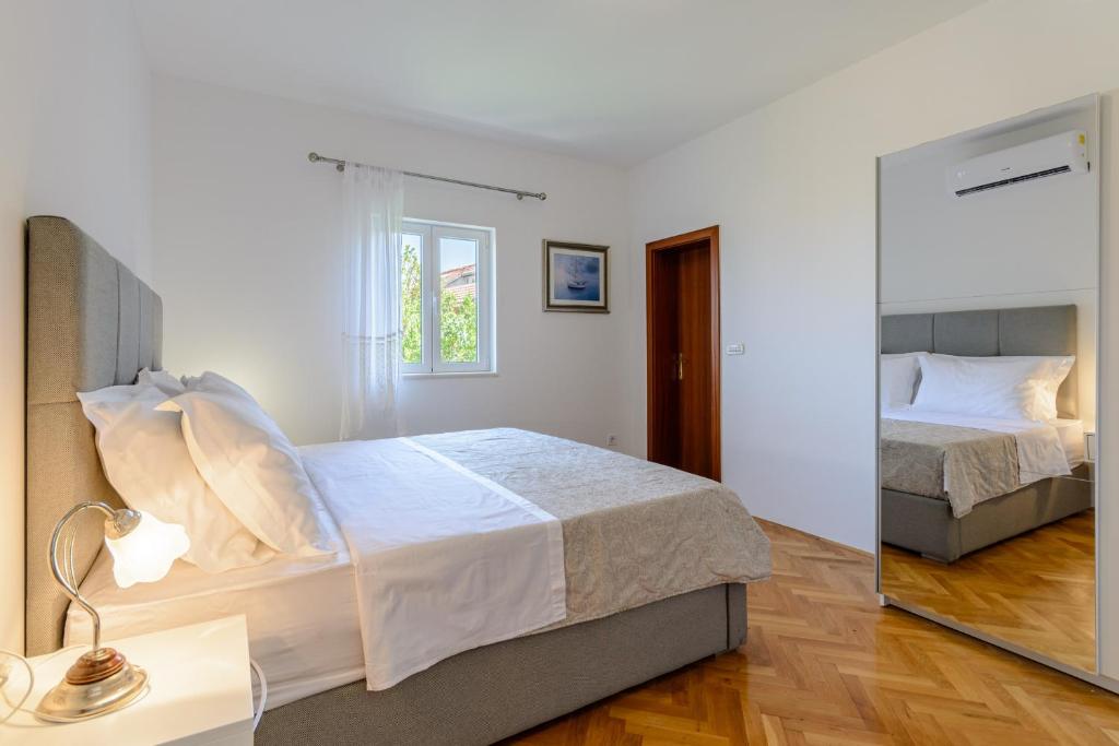 Postel nebo postele na pokoji v ubytování Apartment Marcela